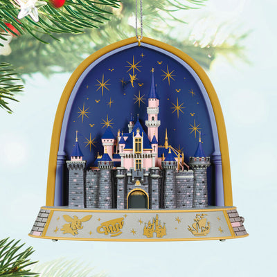 Disneyland 70th Anniversary ornament featuring Sleeping Beauty Castle, fireworks display, and shimmering lights in gold frame arch