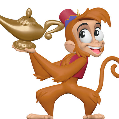 Abu the monkey from Disney’s Aladdin holding the magic lamp in a festive Christmas tree ornament