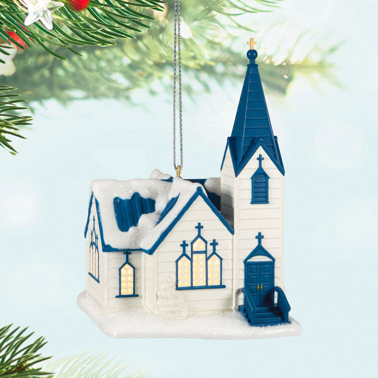 White church ornament with blue roof, steeple, and glowing windows, designed to light up with miniature Christmas light string.