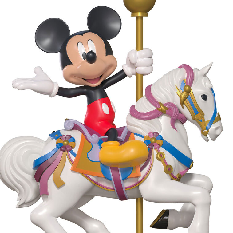 Hallmark Keepsake Disneyland King Arthur Carrousel ornament featuring Mickey Mouse riding a white carousel horse with gold pole, colorful saddle.