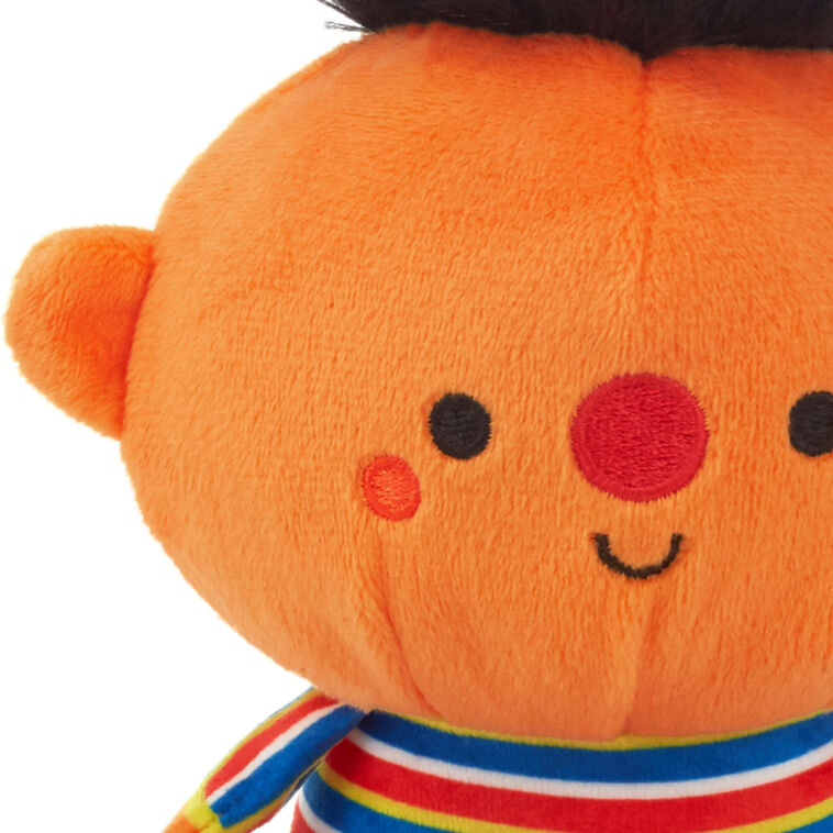Plush Bert and Ernie toys with magnetic connectors, colorful outfits, and embroidered Sesame Street features.
