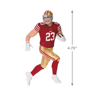 Christian McCaffrey ornament in 49ers red and gold uniform, number 23, action pose with football, Hallmark NFL Christmas collectible