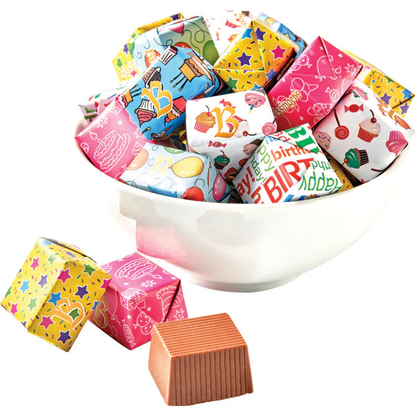 Clear tube of foil-wrapped solid milk chocolate birthday presents made with 38% European milk chocolate.

