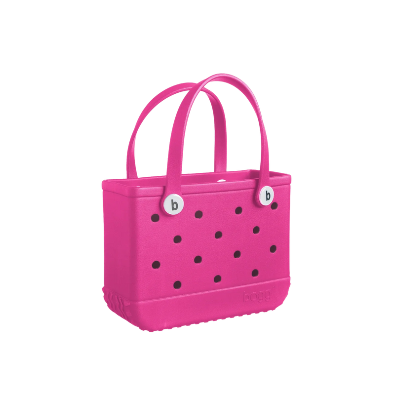 A small bright pink Bitty Bogg Bag with handles and a durable, waterproof build.
