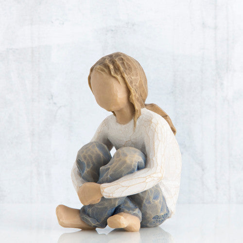 Willow Tree Spirited Child figurine of seated girl with arms wrapped around knees.