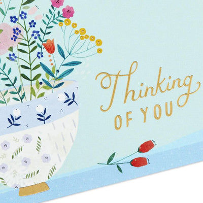 Assorted whimsical note cards with gold foil accents in multiple designs, includes envelopes and reusable caddy.