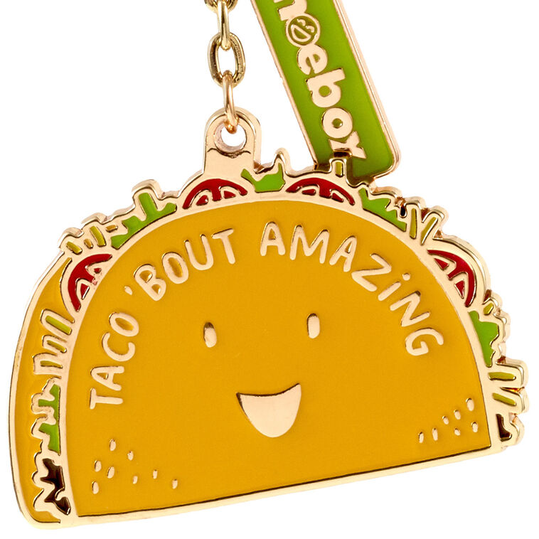 Hallmark taco keychain with smiling yellow taco charm and “Taco &