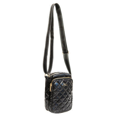 Black quilted crossbody bag with two zipper compartments, back slip pocket, and adjustable strap, perfect for essentials and travel.