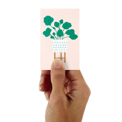 Mini blank note cards with pastel potted plant illustrations on colorful backgrounds, 12-pack with foil accents and matte finish.
