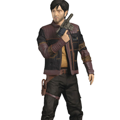 Cassian Andor Christmas ornament holding blaster, wearing brown tactical gear and scarf