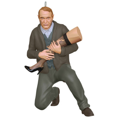Hallmark Keepsake ornament of Old Man Parker kneeling and cradling broken leg lamp, A Christmas Story movie scene