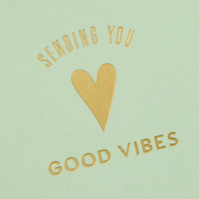 Assorted whimsical note cards with gold foil accents in multiple designs, includes envelopes and reusable caddy.
