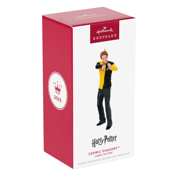 Cedric Diggory in yellow and black Hufflepuff robes raising his wand in a Harry Potter Christmas tree ornament