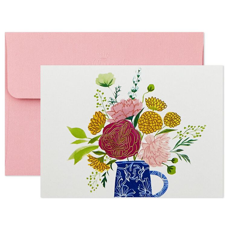 Assorted whimsical note cards with gold foil accents in multiple designs, includes envelopes and reusable caddy.