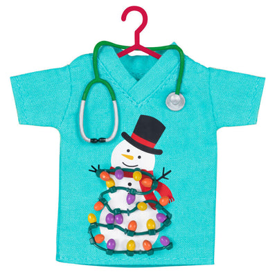 Teal fabric scrubs ornament with snowman and Christmas lights, stethoscope detail, honoring healthcare workers

