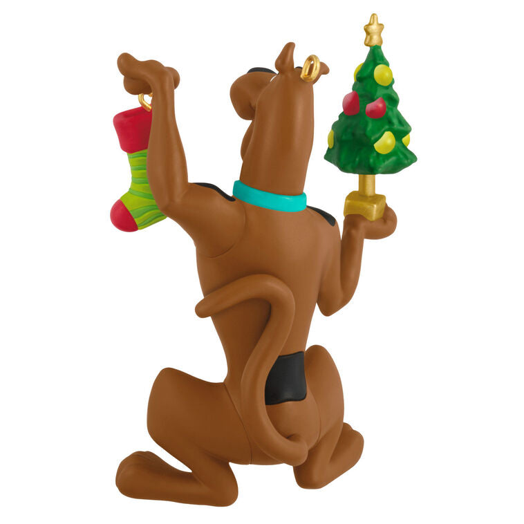 Hallmark Keepsake Tom and Jerry ornament featuring Tom the cat holding Jerry the mouse as a sandwich, with a red napkin tied around his neck.