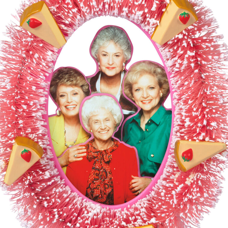 The Golden Girls ornament with photo of Rose, Dorothy, Blanche, and Sophia in pink wreath with strawberry cheesecake slices