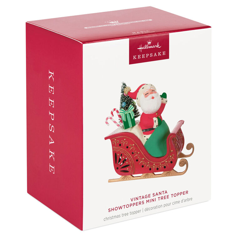 Vintage-style Santa in red sleigh with gifts and lighted base, part of ShowToppers musical tree topper system with synchronized effects.
