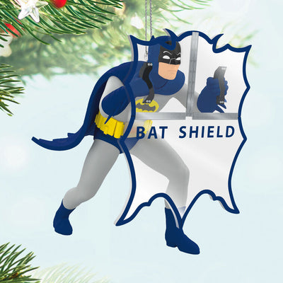 Batman ornament holding Bat-Shield from 1960s TV series, blue and gray costume with yellow accents, nostalgic superhero decoration