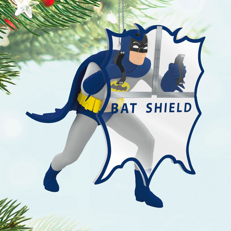 Batman ornament holding Bat-Shield from 1960s TV series, blue and gray costume with yellow accents, nostalgic superhero decoration
