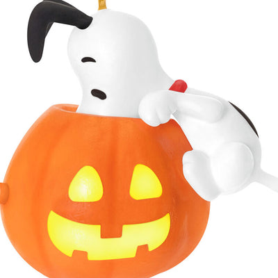 Snoopy Halloween ornament with glowing jack-o'-lantern, plays music and spooky sounds when button is pressed