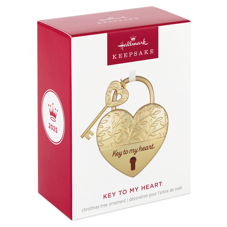 Gold metal heart ornament with leaf-vine design and key, engraved with “Key to my heart” — a romantic gift for newlyweds or partners.