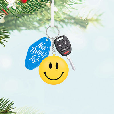 Keychain ornament with car key, smiley face, and blue “New Driver 2025” tag, featuring a small photo frame on back.