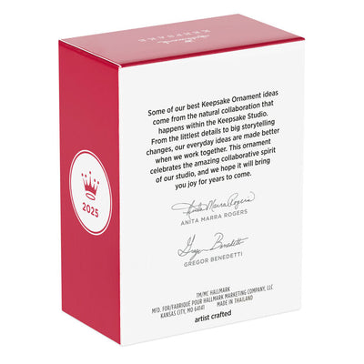 Hallmark Keepsake Tom and Jerry ornament featuring Tom the cat holding Jerry the mouse as a sandwich, with a red napkin tied around his neck.