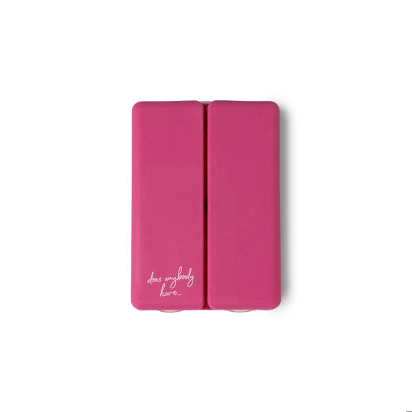 Compact pill and vitamin organizer with seven snap-close compartments and secure magnetic closure, perfect for travel and everyday use.