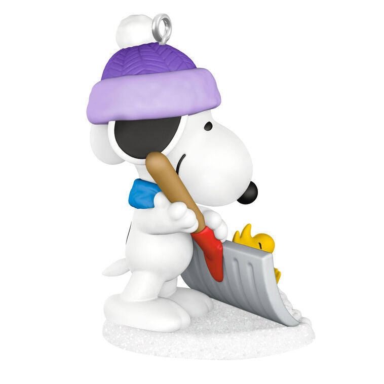 Mini Snoopy ornament in purple hat and scarf shoveling snow, Woodstock riding on shovel, Hallmark Peanuts Christmas collectible