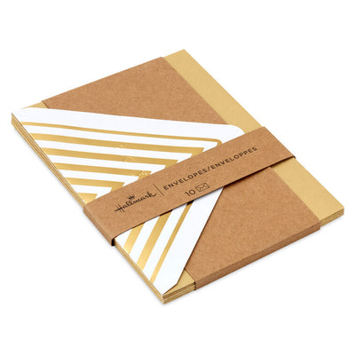 Gold metallic envelopes with white and gold chevron liner and pointed flaps, perfect for cards and special occasions.
