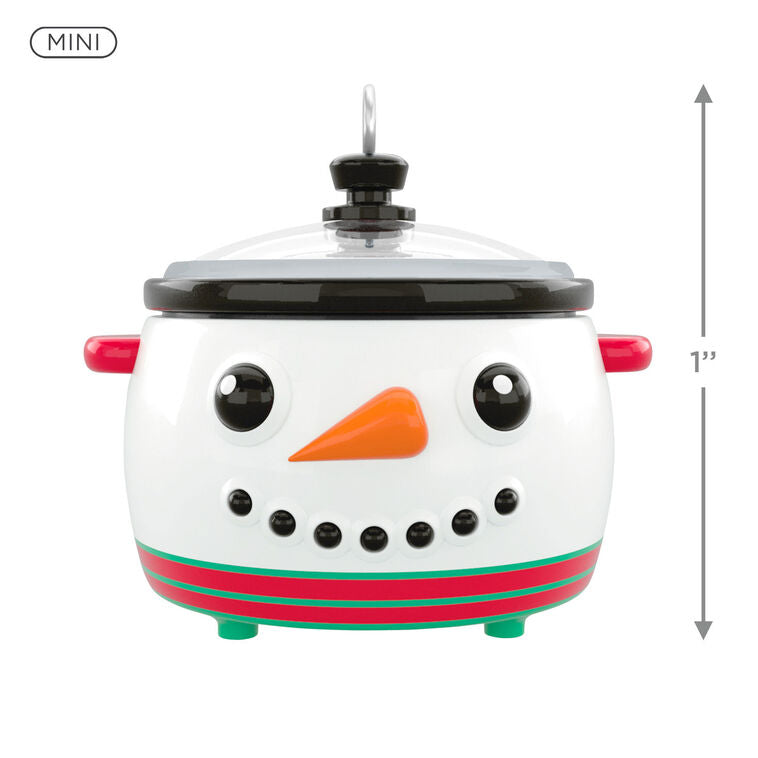 Mini slow cooker Christmas ornament with snowman face, red and green accents, Hallmark Keepsake holiday collectible
