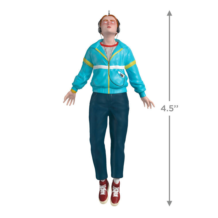 Max Mayfield ornament in blue and yellow windbreaker, levitating with headphones, inspired by Stranger Things TV series.
