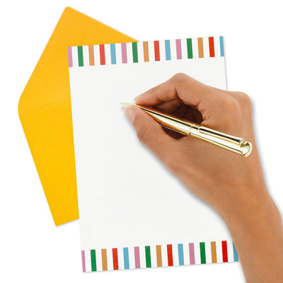 Stationery set with white sheets bordered in bright vertical stripes and colorful envelopes in pink, green, orange, rose, and aqua.
