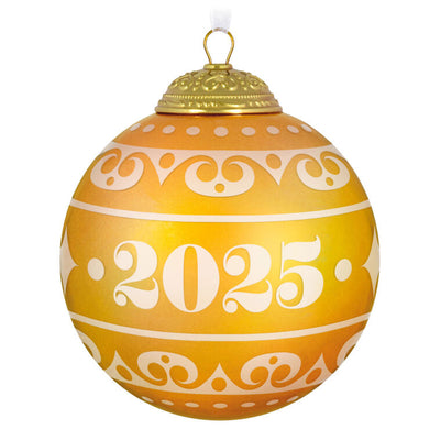 Hallmark Keepsake Christmas Commemorative 2025 ornament—yellow frosted glass ball with elegant gold scroll design, embossed metal cap, and “2025