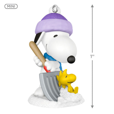 Mini Snoopy ornament in purple hat and scarf shoveling snow, Woodstock riding on shovel, Hallmark Peanuts Christmas collectible
