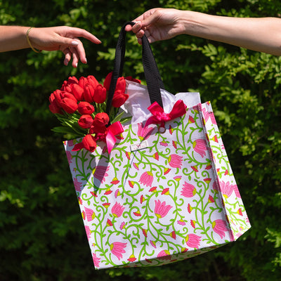 SCOUT Large Package reusable gift bag in Melondramatic pattern with sturdy handles, durable build, and grommets for ribbon or card.