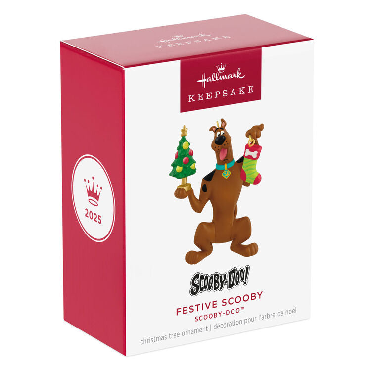 Hallmark Keepsake Tom and Jerry ornament featuring Tom the cat holding Jerry the mouse as a sandwich, with a red napkin tied around his neck.