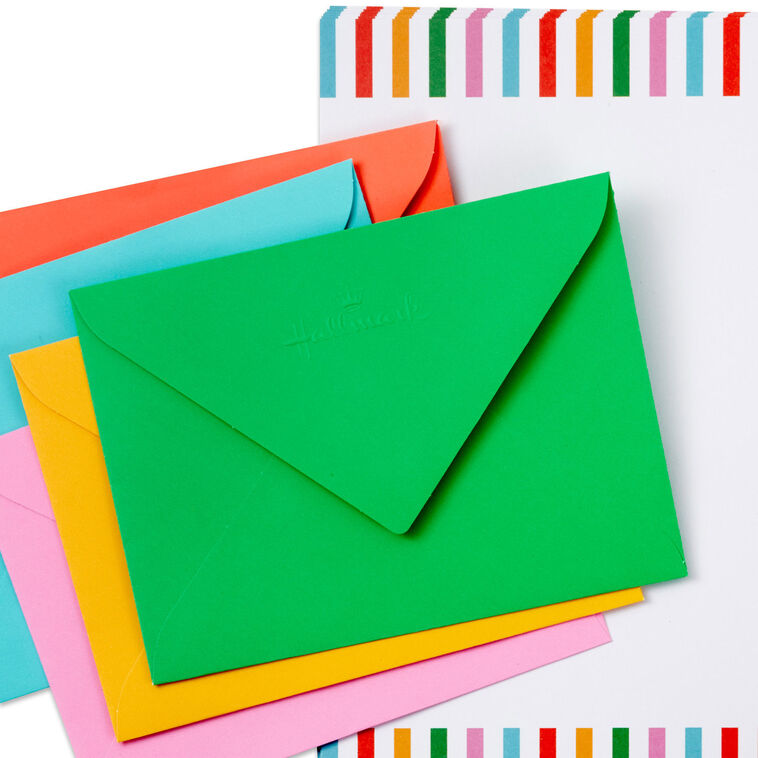 Stationery set with white sheets bordered in bright vertical stripes and colorful envelopes in pink, green, orange, rose, and aqua.
