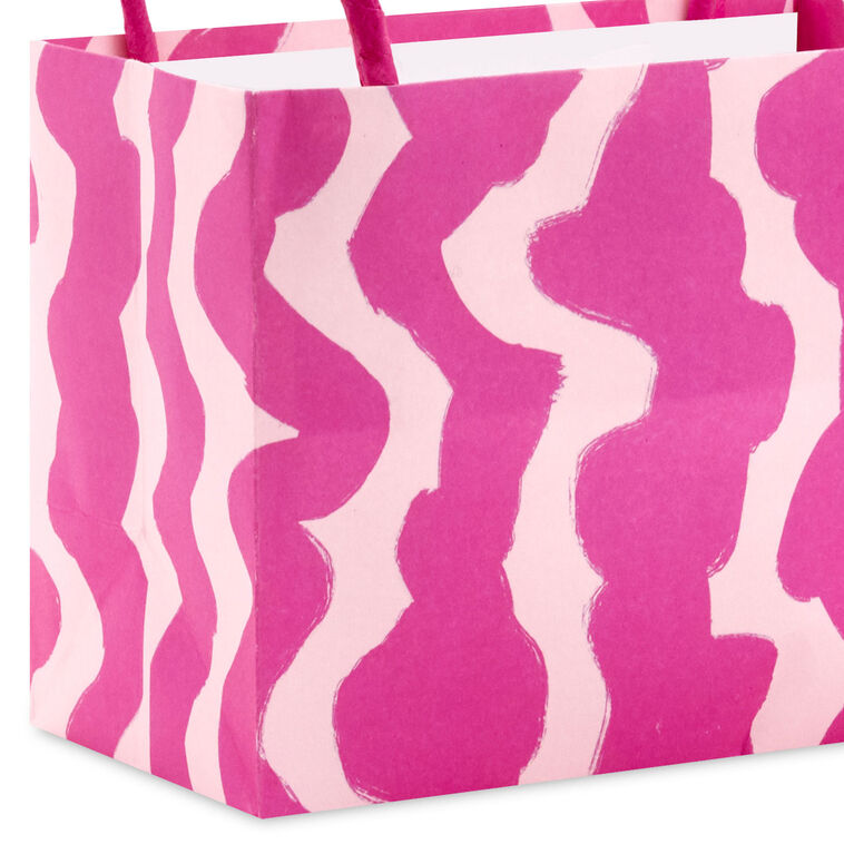 Assorted mini horizontal gift bags with pink stripes, polka dots, squiggles, and multicolor daisies, pink handles, Hallmark
