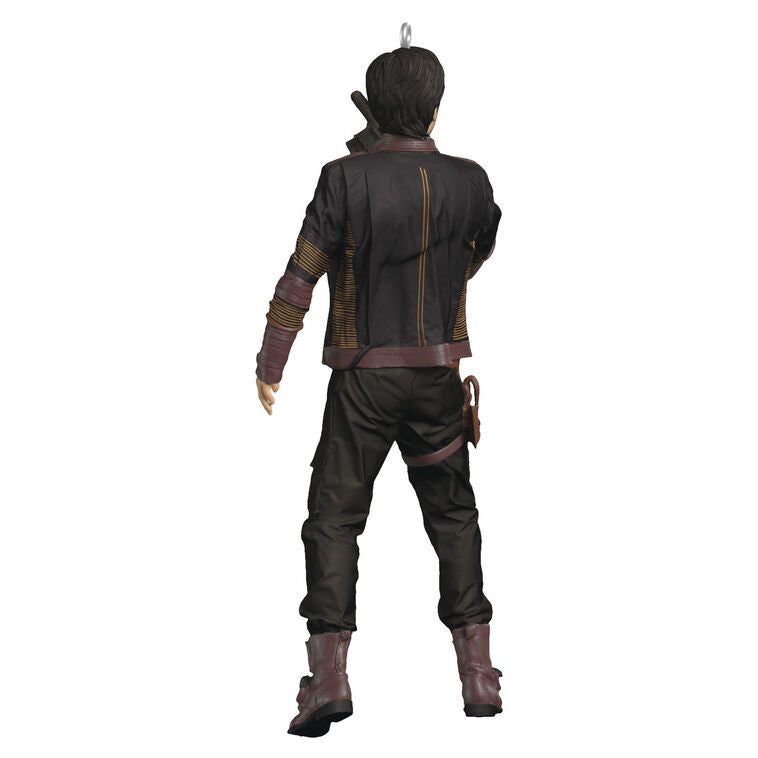 Cassian Andor Christmas ornament holding blaster, wearing brown tactical gear and scarf