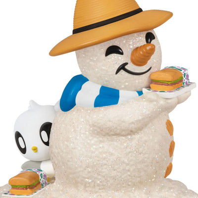 Hallmark Keepsake Sandal the Sandman ornament—sand snowman in Bermuda hat, blue and white scarf, with sub sandwich and sea turtle friend on the beach
