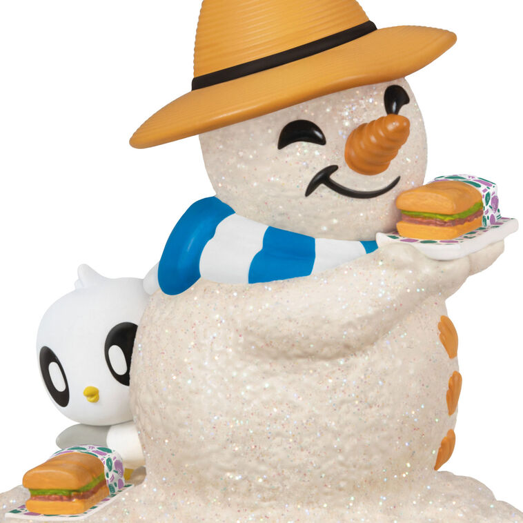 Hallmark Keepsake Sandal the Sandman ornament—sand snowman in Bermuda hat, blue and white scarf, with sub sandwich and sea turtle friend on the beach
