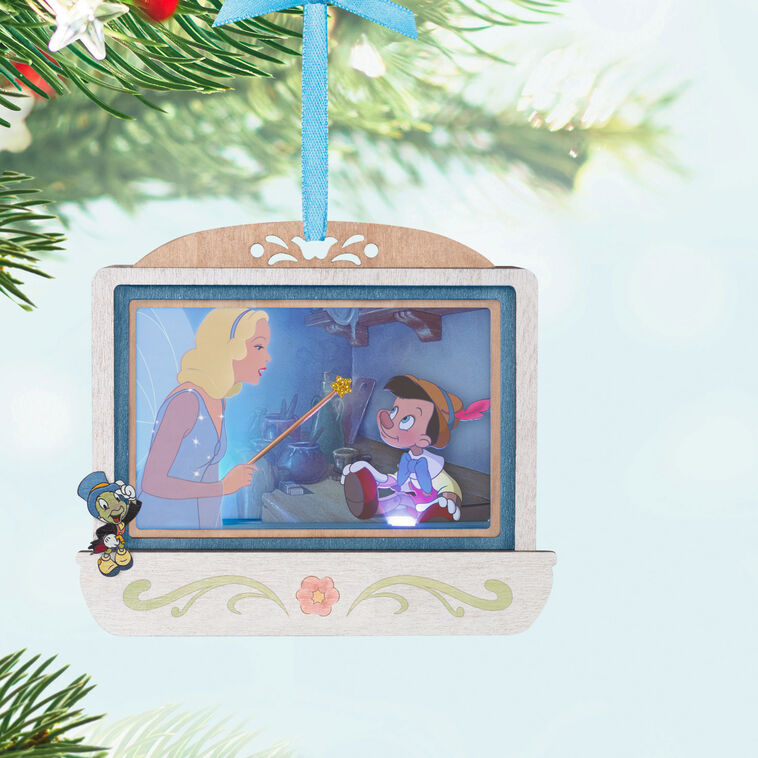 Disney Pinocchio 85th anniversary papercraft ornament with Blue Fairy and Geppetto’s puppet, lit with special effects.

