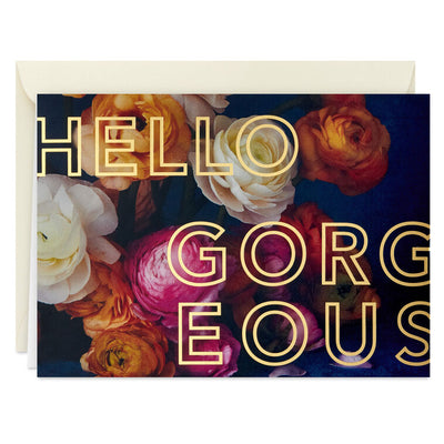Blank note cards with vivid floral background and “HELLO GORGEOUS” gold foil lettering, boxed with envelopes.
