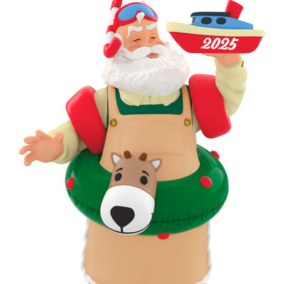 Santa in snorkel mask, arm floaties, and striped socks, with reindeer swim tube and toy boat marked 2025, Hallmark Keepsake ornament
