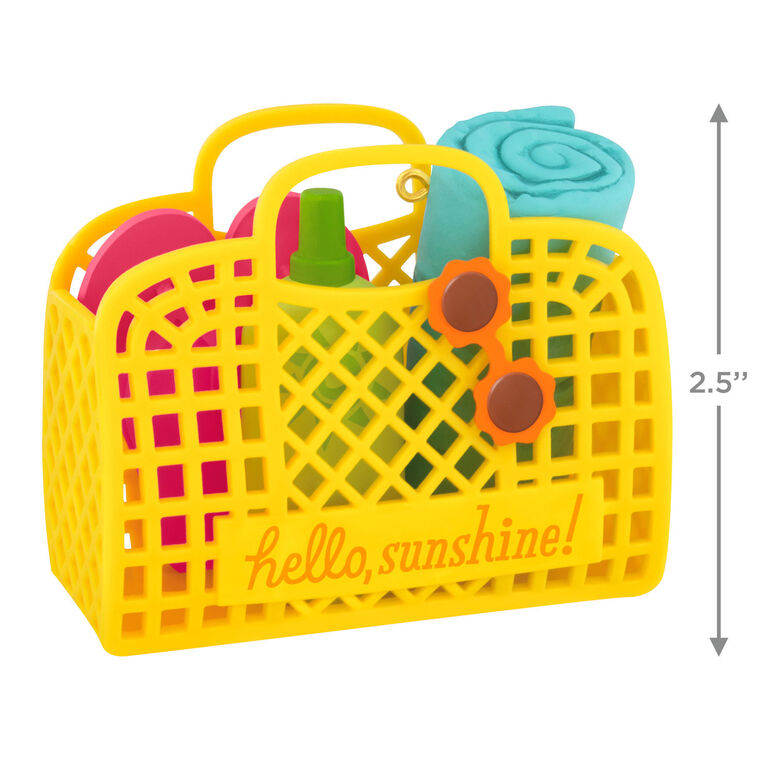 Yellow beach bag ornament with flip-flops, swim towel, sunglasses, and sunscreen, perfect for summer-themed holiday decor

