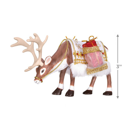 Hallmark Keepsake ornament of a regal reindeer with a festive saddle blanket, faux fur, gold trim, and a present, 2025 Keepsake Premiere.