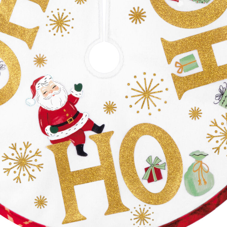 Mini round tree skirt with Santa, snowman, reindeer, gold snowflakes, and red plaid trim, designed to fit small tabletop Christmas trees.