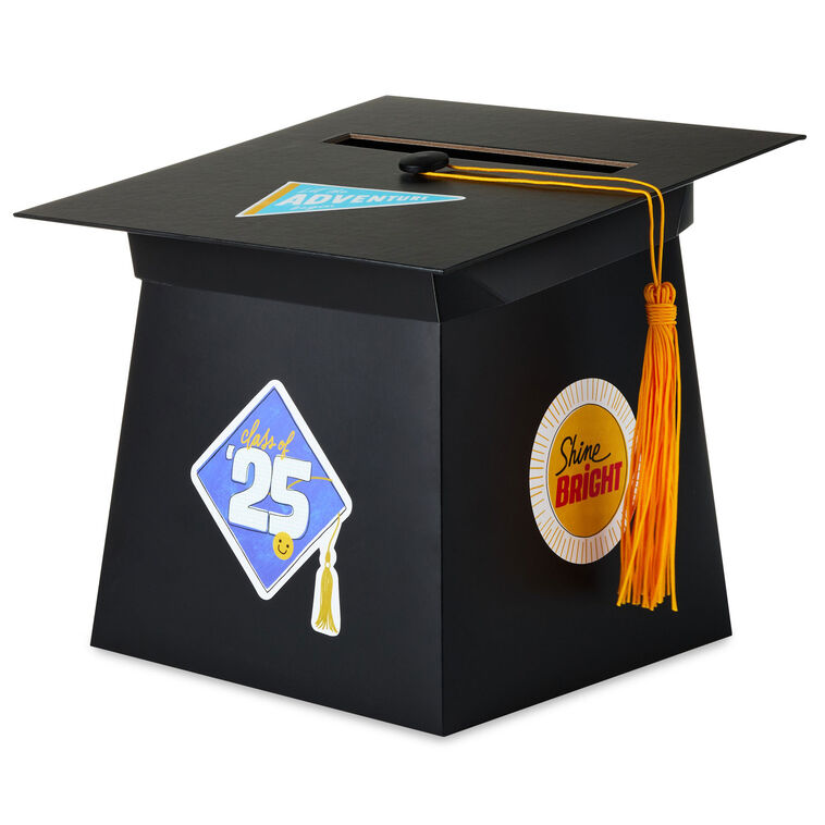 Mortarboard-shaped graduation card holder box with a gold tassel and 2025 stickers for personalizing, perfect for collecting cards and well wishes at a grad party.


